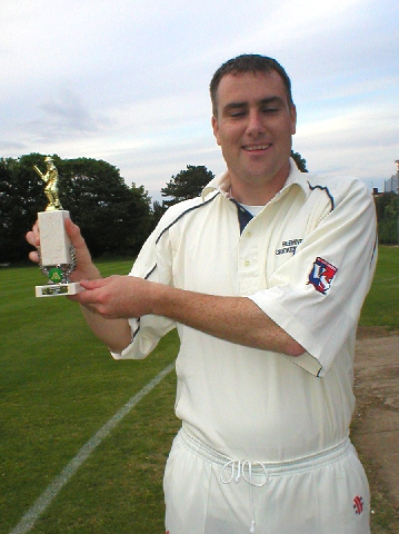 The Beehive's captain with the trophy.