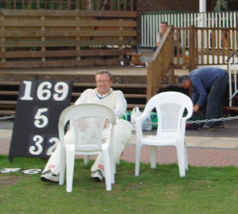 The scoreboard and Arnie Garside.